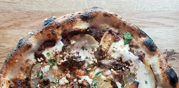 Romesco sauce, roasted lamb, potatoes, roasted garlic, fresh mozzarella, Idiazabal, cannellini vinaigrette, hazelnut.